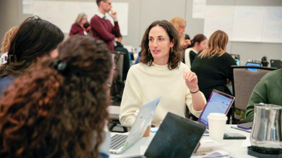 Educators in discussion at a conference